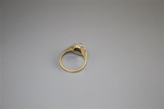 An 18ct and Plat, sapphire and illusion set diamond oval cluster ring, size M, gross weight 3.5 grams,